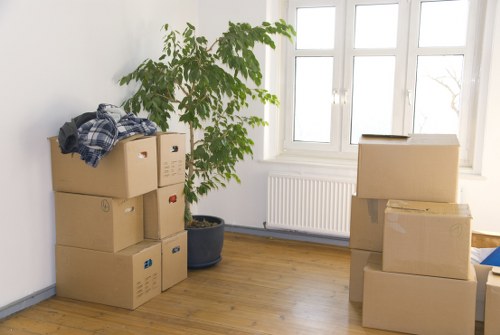 Piano movers protecting floors and walls during a Tufnellpark relocation