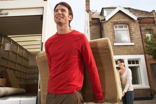 Removal workers wearing PPE during a house move