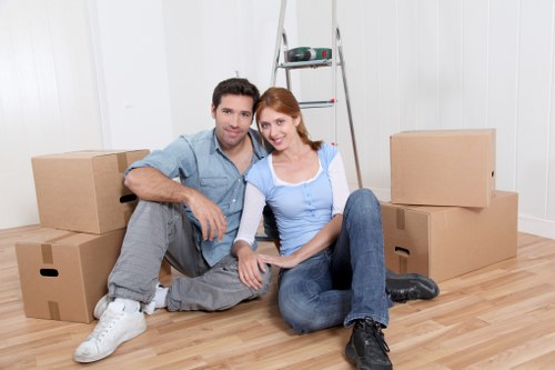 Professional movers handling furniture during house removals in Tufnellpark