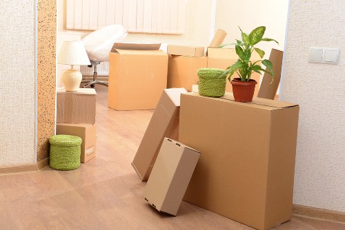 Collection team handling sofas, beds, and wardrobes during furniture removal