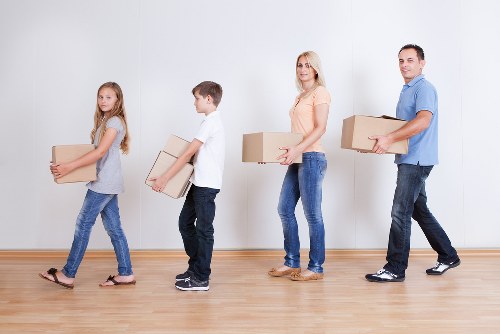 Professional movers carrying furniture during a Tufnell Park relocation